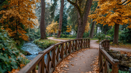 Obraz premium Scenic wooden bridge over a tranquil stream surrounded by vibrant autumn foliage, inviting pathways, and lush greenery, creating a serene natural landscape