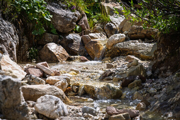 Water flowing in a small mountain river - Italy