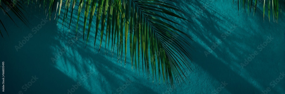 Poster Palm leaf shadow casting an abstract pattern on a turquoise textured surface, evoking a tropical and summer vibe with a minimalist and artistic touch