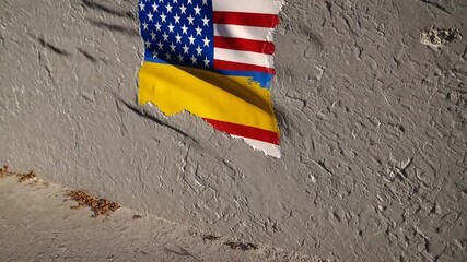 The national flags of two countries painted onto concrete wall surface - Powered by Adobe