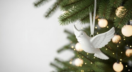 A white ceramic dove ornament hangs from a green Christmas tree branch amidst glowing warm lights decoration bird festive holiday celebration winter seasonal