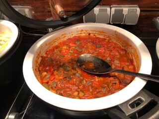 Ratatouille in a serving dish with a spoon