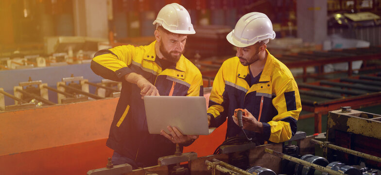 Technician maintains and inspects metal sheets in a metal cheese plant with computers and radio communication systems, industrial support systems and technology concepts.