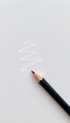 A black pencil with a red tip draws a white zigzag line on a plain white surface