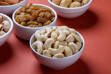 Indian dry fruits called cashews on dark background 