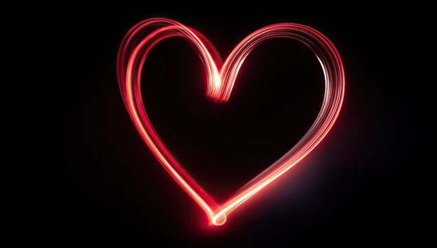 A vibrant, red-toned heart shape created with light painting on a black background