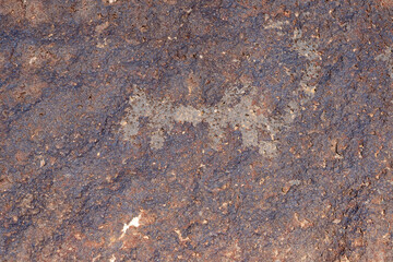 Ancient ornamental carving on volcanic rock