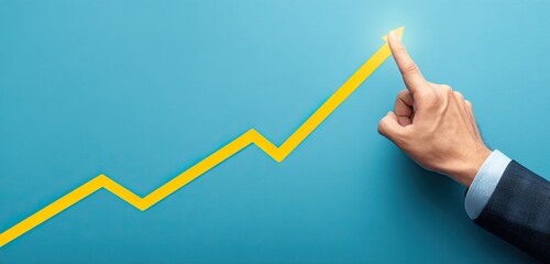 Upward trending yellow arrow pointed by a finger