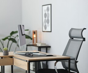 Stylish workplace with modern computer and on wooden table in office