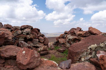 Scenic Volcanic Hills with Red Earth and Vegetation