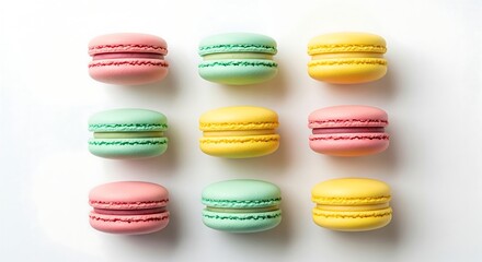 Colorful macarons arranged in a three-by-three grid pattern on a white surface, showcasing pastel shades of pink, green, and yellow.