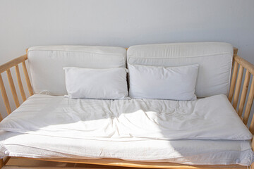 A sofa modern wood frame with white wall