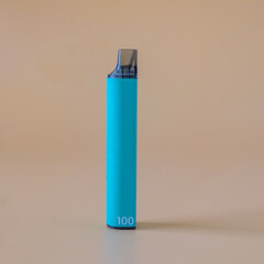 A electronic cigarette on color background. The concept of modern alternative smoking.