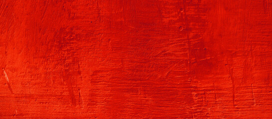 Obraz premium Abstract vibrant red wooden background texture. Perfect for backgrounds, design projects, websites, prints, and artistic compositions requiring a bold touch.
