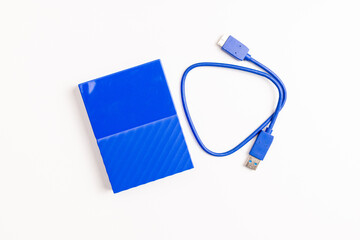 Blue External Hard Disk with USB Cable on White Background