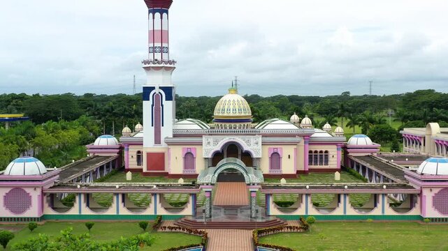 Barishal, Bangladesh - 22 August 2025: Aerial view of Baitul Aman Jame Masjid Complex, a colorful and imposing structure standing majestically against a green backdrop.