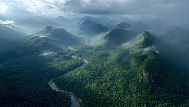 Lush mountain ranges and a winding river carved through a dense jungle