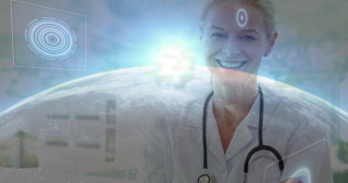 Smiling female doctor presenting interface in clinic, with stethoscope, tablet, globe, copy space