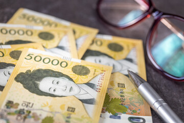 South Korea money, Business concept, Expense analysis. 50-won bills, Business background, close-up