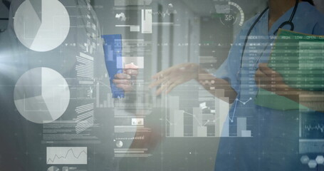 Nurse and physician discussing data overlays in corridor with stethoscope green folder blue tablet