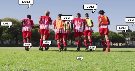 Jogging soccer players wearing red-striped jerseys and yellow bibs on grass field, with LOL bubbles