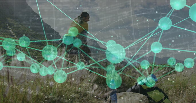 Climbing female and male hikers navigating grassy mountain slope, with backpack and digital overlay