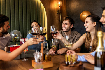 Friends Celebrating Birthday in Restaurant