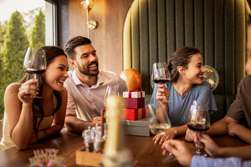 Friends Talking and Smiling at Birthday Celebration