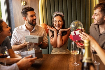 Friends Giving Presents to Birthday Girl