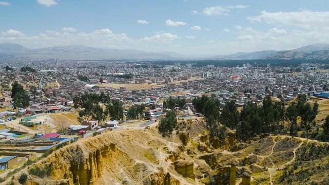 Drone footage of Huancayo&rsquo;s urban expanse in the Peruvian highlands, bright sunlight.