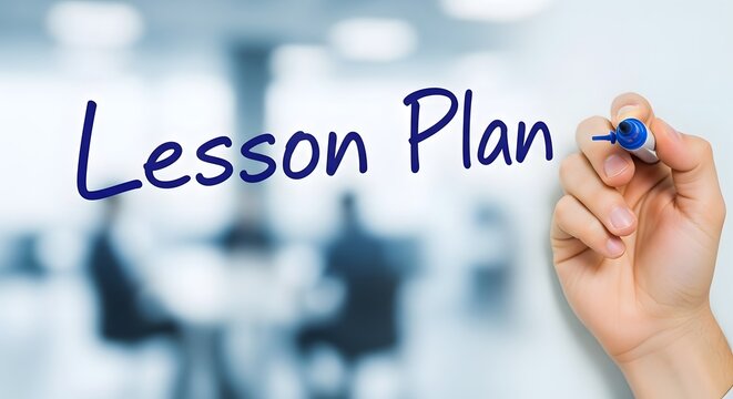 Photo of hand writing the words lesson plan on a blurred