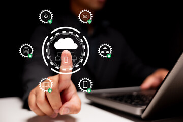 Cloud security and data protection. A businessman uses a digital touchscreen interface in a modern office to access encrypted cloud services, ensuring safe communication and information storage.