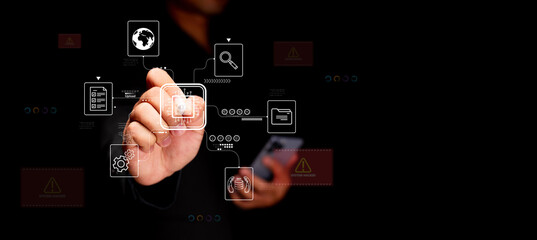 Cybersecurity and digital data flow. A businessman uses a smartphone and touchscreen interface in a modern office, managing secure file uploads, system protection, and encrypted information.