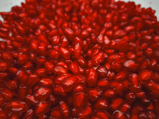 Ripe pomegranate seeds filling frame, celebrating rosh hashanah and mythology