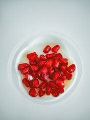 Yogurt dessert with pomegranate seeds celebrating rosh hashanah and mythology