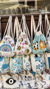 Handmade Greek drawstring bags & pouches. Vibrant evil eyes, rainbows, animals, local motifs. Summer souvenirs from Kavala, Greece.