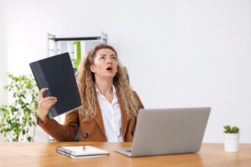 Air conditioning. Woman suffering from heat at workplace in office