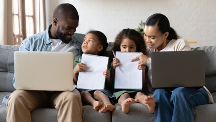 Family engagement in creative learning at home digital interaction indoor setting cozy atmosphere close-up perspective