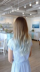 Woman with Long Ombre Hair in a Light Blue and Teal Color Scheme at a Hair Salon