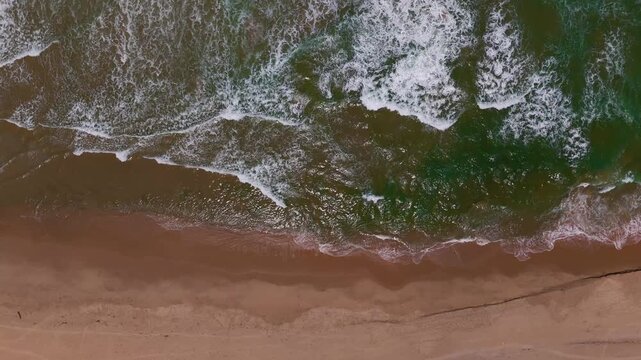Serene Drone Approach Over Ocean Shoreline for Travel and Relaxation