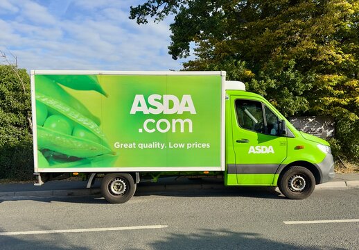 Essex, UK - August 22, 2025: An Asda supermarket delivery van parked on the road in a residential area. 