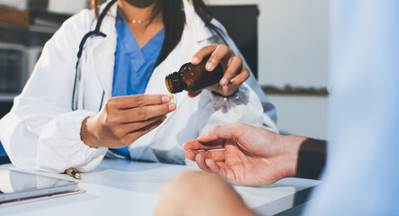 Young brunette woman having consultation at doctor office during