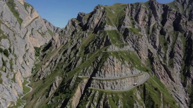 Aerial Perspective of Serpentine Mountain Thoroughfare Traversing Rugged Elevated Terrain