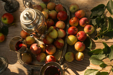 Still life composition of ripe apples arranged in a garden setting.