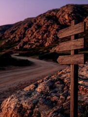 Scenic travel destination with a wooden signpost at sunset