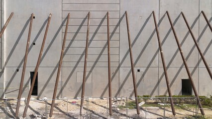 Construction Aerial view of exterior precast concrete wall panels supported by steel columns.