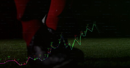 Black cleat in red pants pressing soccer ball on grass field, neon chart overlay, copy space