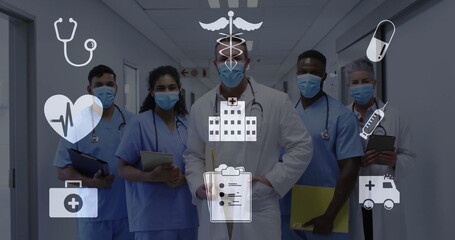 Staff wearing scrubs, holding clipboards and tablet in hospital hallway with icons