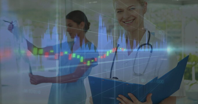 Analyzing candlestick overlay, doctor holding folder, nurse reading X-ray in corridor, copy space