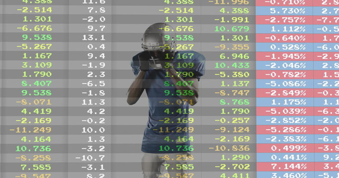 Gripping football helmet, gloved player in blue jersey standing against financial data backdrop